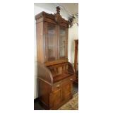 1066	VICTORIAN CYLINDER ROLL TOP SECRETARY W/BOOKCASE TOP, GLASS DOORS ARE BEVELED, 32 3/4 IN WIDE X