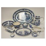 1182	12 PIECES OF BLUE WILLOW INCLUDING 18 1/2 IN PLATES, TEA  POT IS 9 1/2 IN HIGH