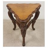 1021	UNUSUAL CORNER TABLE W/A BOOKMARKED VENEER TOP & CARVED WINGED CHERUB LEGS, 22 1/4 IN HIGH