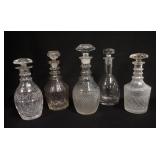 1122	LOT OF 5 CRYSTAL DECANTERS INCLUDES CUT & PRESSED, ONE HAS 3 APPLIED NECK RINGS, TALLEST 11 3/4