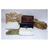 1215	GROUP OF 7 PURSES, LARGEST IS 12 1/2 IN X 8 IN WITH SEA SHELL DECORATION. 2 ARE SIGNED, ONE IS 