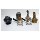 1222	GROUP OF SIX METAL LIGHTERS. TALLEST IS 4 1/2 IN H 