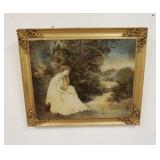 1253	PRINT OF A SEATED LADY IN A GILT BRASS CORNER FRAME. 24 1/4 IN X 20 1/4 IN. INCLUDING FRAME