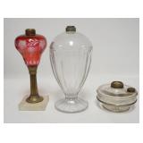 1259	GROUP OF THREE KEROSENE LAMPS. ONE IS RUBY STAIN CUT TO CLEAR & ONE HAS AN UNUSUAL LARGE FRONT.