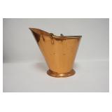 1263	HAND MADE COPPER COAL SKUTTLE BY COLONIAL VIRGINIA, HAS BRASS HANDLE. 11 3/4 IN H 