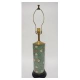 1007	CYLINDRICAL PORCELAIN LAMP W/FLOWERS & SCROLLS, HAS WOODEN BASE, CORD CUT, 29 1/4 IN HIGH