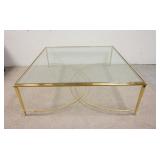 1025	BRASS GLASS TOP COFFEE TABLE, TOP IS BEVELED, 48 IN SQUARE X 17 1/2 IN HIGH