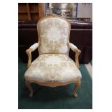 1027	FLORAL CARVED UPHOLSTERED ARM CHAIR