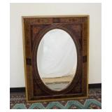 1035	ORNATE REVERSE GLASS DECORATED PANNELED FRAME WITH OVAL BEVELLED MIRROR, 36 IN X 48 IN