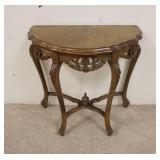 1048	DEMILUNE STAND WITH CARVED SKIRT, 24 IN X 12 IN X 25 IN