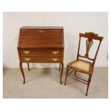 1049	ANTIQUE MAHOGANY LADIES WRITING DESK WITH 2 DRAWERS AND CANE SEAT DESK CHAIR. DESK IS 28 IN WID
