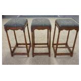 1125	THREE BAR STOOLS. UPHOLSTERY HAS STAINING. 15 IN X 31 IN H 