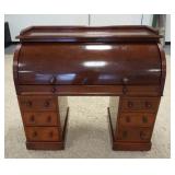 1134	VICTORIAN CYLINDER DESK W/ GREEN TOOLED LEATHER INTERIOR & PULL OUT SIDES. HAS ELAVATED SECRECT