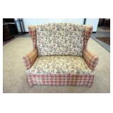 1164	UPHOLSTERED COLONIAL STYLE WINDOW BENCH WITH HIGH WING BACK SIDES, FADING ON UPHOLSTERY. 50 IN 