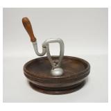 1216	SPRING LOADED NUTCRACKER MOUNTED IN A WOODEN BOWL, TURNED WOODEN HANDLE, 8 3/4 IN DIAMETER