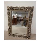 1245	BEVELED GLASS MIRROR IN A COMPISITE SILVER FRAME. 32 IN X 42 IN 
