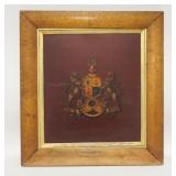 1268	PAINTING ON BOARD OF A COAT OF ARMS IN A MAPLE FRAME. 20 1/2 IN X 22 IN INCLUDING FRAME