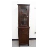 1020	2 PIECE CABINET W/ DISPLAY TOP & STORAGE BASE. BASE HAS DRAWER & DOOR W/ INTERIOR SHELVES. TOP 