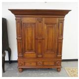 1026	TV CABINET IN THE FORM OF A KAS FRAME TWO DOORS HAS A DRAWER BENEATH PANELED DOORS & DRAWER FRO