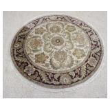1031	ROUND FLORAL RUG. 5 FT 1IN DIAMETER