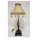 1072	METAL BLACKAMOOR LAMP, HAS CLOTH SHADE W/FRINGE, MOUNTED ON A WOODEN BASE, 29 IN HIGH