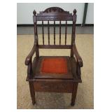 1104	CARVED POTTY CHAIR W/TURNED SPINDLE BACK, HAS INSERT