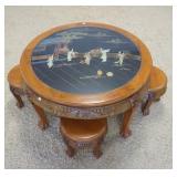 1109	ROUND ASIAN TABLE W/3 SMALL SEATS, HAS PAINTED & CARVED STONE DECORATION UNDER THE GLASS TOP, 3