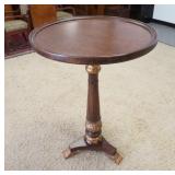 1131	TALL ROUND PEDESTAL TABLE, HAS GILT TRIM & STYLIZED CLAW FEET, 30 IN DIAMETER, 42 IN HIGH