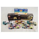 1268	LOT OF EIGHT DIE CAST 1:24 SCALE NASCAR MODEL CARS INCLUDING THREE W/ THE ORIGINAL BOXES. 