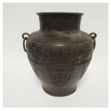 1002	ANTIQUE BRONZE DOUBLE RING HANDLED URN WITH CHARACTER MARKS ON BASE. PREVIOUSLY DRILLED FOR A L