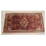1061	SMALL ANTIQUE ORIENTAL THROW RUG, 48 1/2 IN X 24 IN