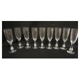 1069	GROUP OF 9 WHEEL CUT CHAMPAGNE FLUTES SIGNED BODA ON BASE, 8 1/2 IN HIGH