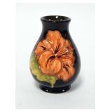 1118	MOORCROFT BUD VASE. 3 7/8 IN H 