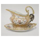 1120	EXCEPTIONAL HAND PAINTED GRAVY BOAT W/ MULTIPLE FLOWER DESIGN & ELABORATE GOLD TRIM & RAMS HEAD