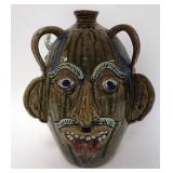 1157	ALBERT HODGE GROTESQUE 3 FACE JUG,VALE N.C., JUG HAS A GREEN AND BLUE DRIP GLAZE, 3 FACES AND 3