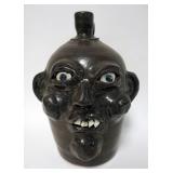 1158	HARROLD AND GRACE NELL HEWELL GROTESQUE FACE JUG, GILLSVILLE GA, SIGNED AND DATED ON BOTTOM 99,