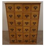 1182	OAK 24 DRAWER CABINET. 27 IN W, 9 1/2 IN DEEP, 40 IN H 