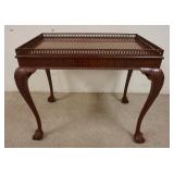 1190	MAHOGANY BALL & CLAW FOOT TABLE W/ PIERCED GALLERY. 34 IN X 22 IN, 28 IN H 