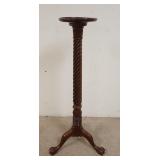 1193	MAHOGANY TALL CLAW FOOT PEDESTAL W/ TWIST COLUMN. 12 IN TOP DIAMETER. 52 IN H 