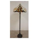 1217	CONTEMPORARY LEADED GLASS FLOOR LAMP W/ ORNATE METAL BASE. 62 IN H 