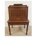 1222	WALNUT VICTORIAN FALL FRONT DESK ON HIGH TURNED LEGS HAS ONE DRAWER INTERIOR COMPARTMENTS W/ TW