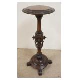 1223	ORNATLEY CARVED VICTORIAN WALNUT PEDESTAL ONE DROP FINIAL IS MISSING. 14 IN TOP DIAMETER. 35 IN