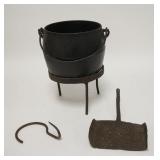 1253	IRON POT W/ STAND, LADLE & HANGING HOOK. THE POT IS 5 1/2 IN H 