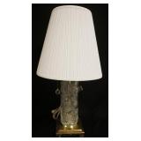 1260	CUT CRYSTAL LAMP W/ BRASS BASE HAS FACETED CRYSTAL BALL FINIAL & PULLS & A PLEATED CLOTH SHADE.