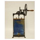 1292	DAZEY BUTTER CHURN	DAZEY BUTTER CHURN TIN W/ WOODEN LID & IRON FRAME & MECHANISM