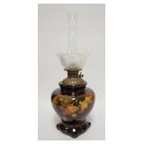 1057	WELLER LARGE KEROSENE LAMP, POTTERY PORTION IS 11 3/4 IN HIGH