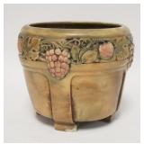 1088	UNMARKED JARDINIERE W/FRUIT PATTERN, HAS A CHIP ON ONE FOOT, 8 1/4 IN HIGH, 9 IN TOP DIAMETER