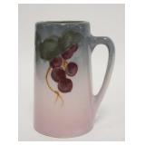 1108	ART POTTERY MUG, FRUIT, FAINT IMPRESSED NUMBERS ON THE BASE, 6 1/4 IN HIGH