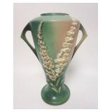 1139	ROSEVILLE FOXGLOVE TALL GREEN VASE, HAS A SMALL RIM CHIP ON THE TOP EDGE THAT HAS BEEN COLORED 