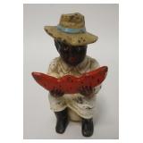 1004	FIGURAL CAST IRON STILL BANK. BOY ON A CHAMBER POT. HAS FEATHERED SCREW